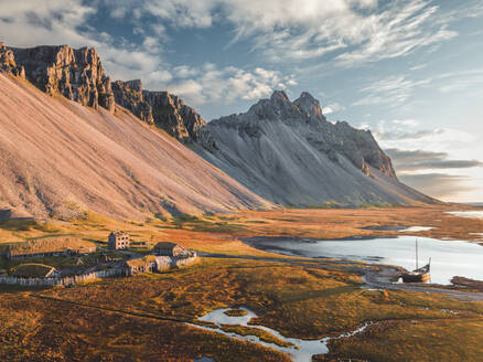 Aerial view of a Viking village with Vestrahorn Mountain in background, Austurland, Iceland. - AAEF18627