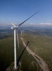 Aerial view of wind turbine over Monte Xiabre in Vilagarcia city, Pontevedra, Galicia, Spain. - AAEF18704