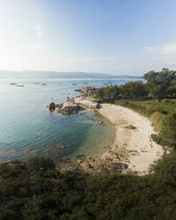 Aerial view of Punta cabalo lighthouse and Sualaxe beach in Illa de Arousa, Ria de Arousa, Pontevedra, Galicia, Spain. - AAEF18712