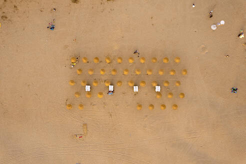 Aerial view of beach umbrellas, Platja de Llevant, El Cabanyal, Valencia, Spain. - AAEF18796