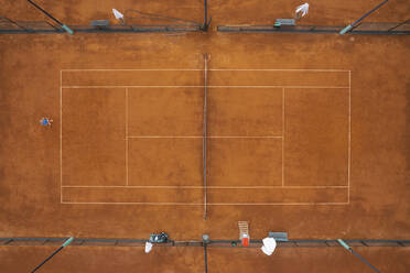 Aerial view of a tennis court club with a player waiting for his opponent, Trinitat, Valencia, Spain. - AAEF18832