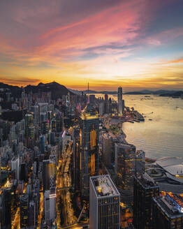 Aerial view of Hong Kong skyline at sunset along Hong Kong Island coastline, China. - AAEF18871