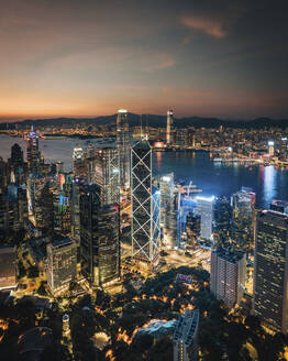 Aerial view of Hong Kong skyline and the financial district at sunset along Hong Kong Island coastline, China. - AAEF18883