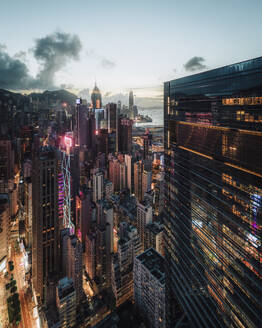 Aerial view of Hong Kong skyline and the financial district at sunset along Hong Kong Island coastline, China. - AAEF18887