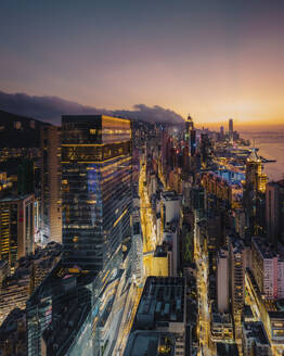 Aerial view of Hong Kong skyline and the financial district at sunset along Hong Kong Island coastline, China. - AAEF18889