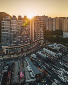 Aerial view of Shipyard in the harbour along the Sham Wan Bay at sunset, Hong Kong island, China. - AAEF18894