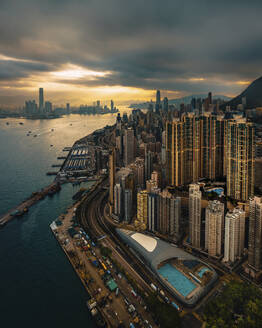 Aerial view of Hong Kong skyline at sunset along Hong Kong Island coastline, China. - AAEF18895