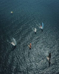 Aerial view of sailing boats during the day at Hong Kong bay, China. - AAEF18898