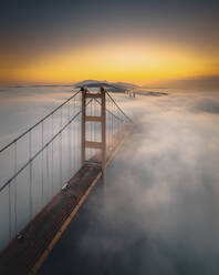 Aerial view of Tsing Ma Bridge at sunset with low clouds in Hong Kong Island, Hong Kong, China. - AAEF18908