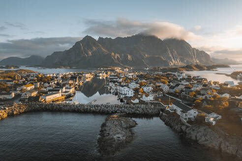 Aerial drone view of a nordic sea village in the Atlantic ocean, Henningsvaer, Lofoten, Norway. - AAEF19015