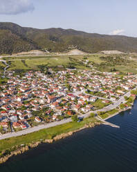 Aerial view of Mikri Volvi, a small town along Limni Volvi Lake in Central Macedonia, Greece. - AAEF19058