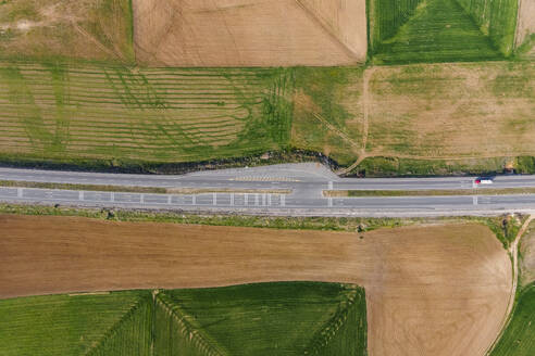 Aerial view of a truck driving on the highway along Lake Tuz in Central Anatolia region, Ankara, Turkey. - AAEF19071