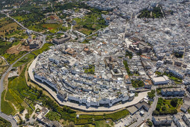 Aerial view of Ostuni old town, the white town near Brindisi, Puglia, Italy. - AAEF19121