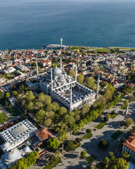 Aerial view of Sultanahmet Camii (the Blue Mosque) in Istanbul Sultanahmet district on the European side during the Muslim holiday, Turkey. - AAEF19135