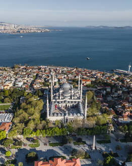 Aerial view of Sultanahmet Camii (the Blue Mosque) in Istanbul Sultanahmet district on the European side during the Muslim holiday, Turkey. - AAEF19138