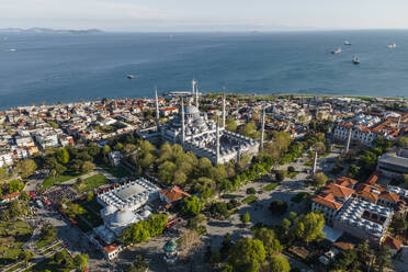 Aerial view of Sultanahmet Camii (the Blue Mosque) in Istanbul Sultanahmet district on the European side during the Muslim holiday, Turkey. - AAEF19140