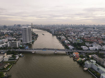 Aerial view of a bridge over the Chao Phraya River in Bangkok, Thailand. - AAEF19170