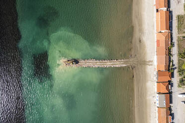 Aerial view of a crane working on the breakwater along the beach in Follonica, Grosseto, Tuscany, Italy. - AAEF19188