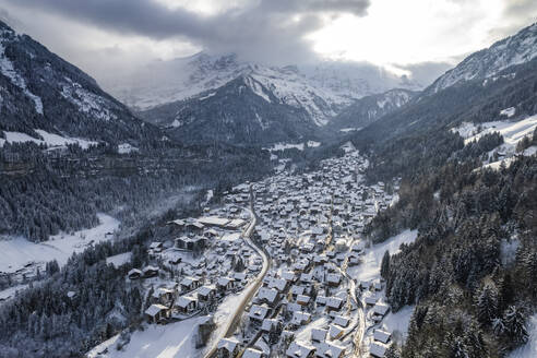 Aerial view of Champery, a small town on the Alps in wintertime with snow, Valais, Switzerland. - AAEF19203