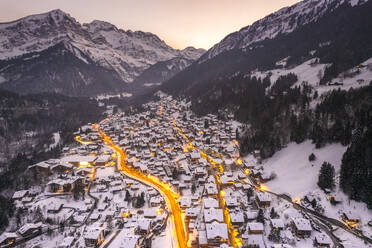 Aerial view of Champery at sunset, a small town on the Alps in wintertime with snow, Valais, Switzerland. - AAEF19208