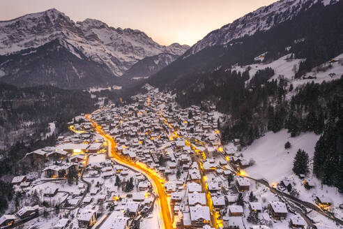 Aerial view of Champery at sunset, a small town on the Alps in wintertime with snow, Valais, Switzerland. - AAEF19208