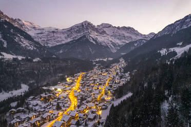 Aerial view of Champery at sunset, a small town on the Alps in wintertime with snow, Valais, Switzerland. - AAEF19209