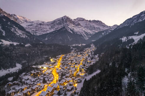 Aerial view of Champery at sunset, a small town on the Alps in wintertime with snow, Valais, Switzerland. - AAEF19209