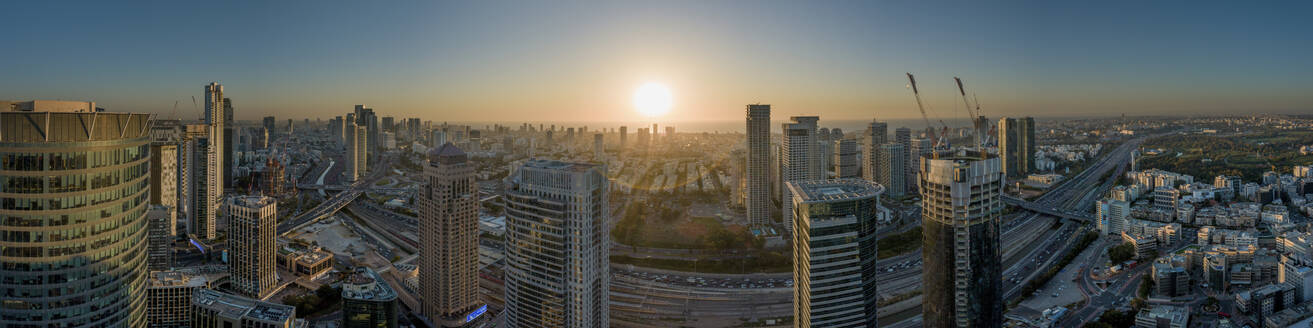 Panoramic aerial view skyscraper in financial district at sunset, Tel Aviv, centre district, Israel. - AAEF19219