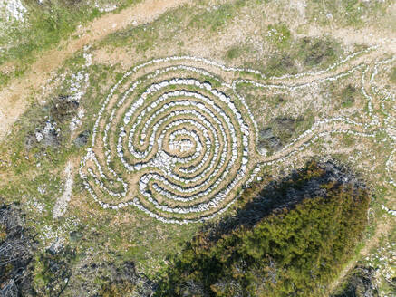 Aerial view of mystical stone formation on the coast of Kamenjak in Istria, Croatia. - AAEF19236