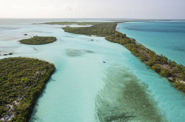 Aerial View of boaters enjoying a stop on their tour through the island chain, Berry Islands, the Bahamas. - AAEF19242