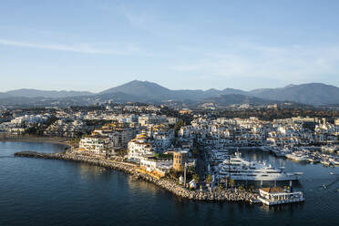 Aerial view of boats and yachts anchored at Puerto Banus harbour along the Mediterranean coastline, Andalusia, Marbella, Spain. - AAEF19251