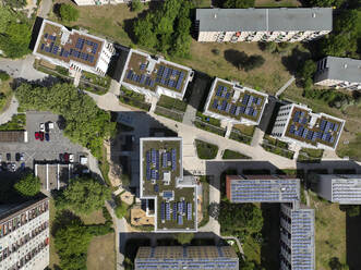 Aerial view of solar panels and roof greening measures in a housing estate in Berlin, Germany. - AAEF19289