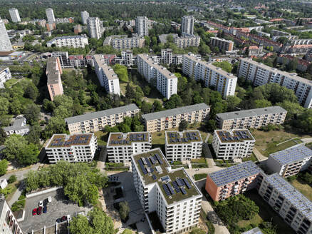 Aerial view of solar panels and roof greening measures in a housing estate in Berlin, Germany. - AAEF19290