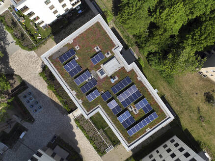 Aerial view of solar panels and roof greening measures in a housing estate in Berlin, Germany. - AAEF19291