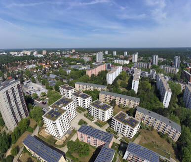 Aerial view of solar panels and roof greening measures in a housing estate in Berlin, Germany. - AAEF19296