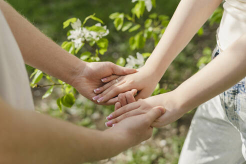 Young couple holding hands at park - SEAF01935