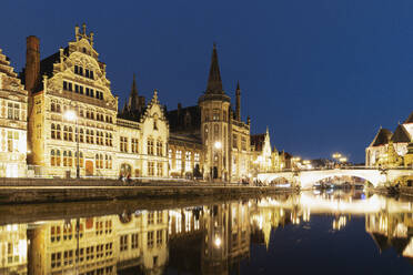 Belgium, East Flanders, Ghent, Historic buildings reflecting in Lys river canal at night - GWF07830