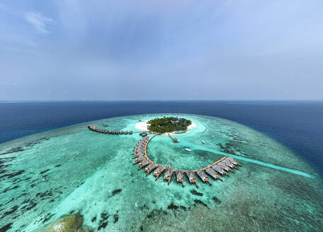 Scenic view of sea with bungalows on Thulhagiri Island at Maldives - AMF09921