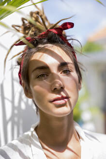 Woman with headband at sunny day - IKF00836