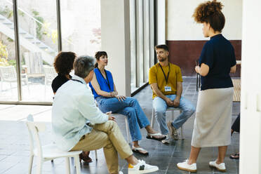 Business colleagues having meeting together in office - EBSF03634