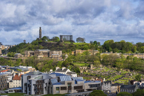 UK, Scotland, Edinburgh, Clouds over Calton Hill, Old Royal High School, New Calton Burial Ground and Scottish Parliamentary Building - ABOF00900