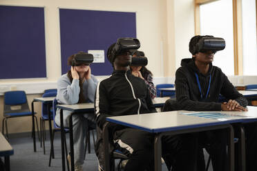 Students (16-17) wearing VR headsets in class - ISF26107