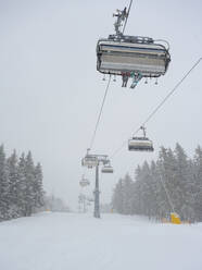 Ski lift in snowfall - ISF26253