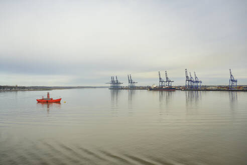 Cranes at Port of Felixstowe and calm sea, UK - ISF26258