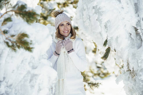 Happy woman enjoying winter snow - JSMF02793