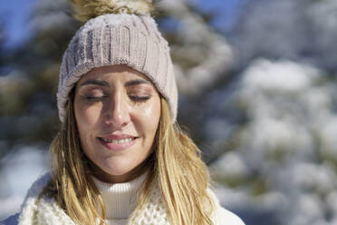 Beautiful woman with eyes closed in winter - JSMF02797