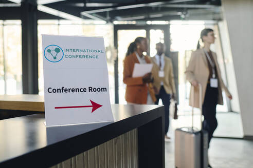 Conference room sign on reception desk at convention center - DSHF00867