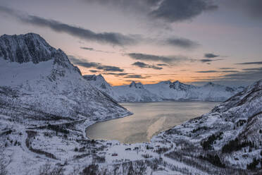 Norway, Nordland, View of Melfjorden and surrounding mountains in winter - RUEF04101