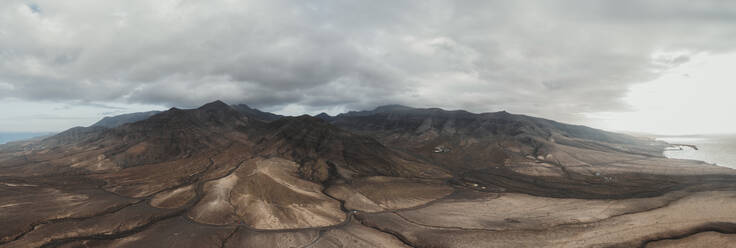 Volcanic landscape with clouds at Fuerteventura - RSGF00940