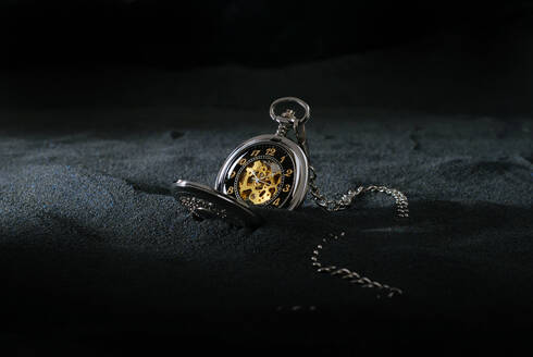 Pocket watch on dark background - CAIF33611